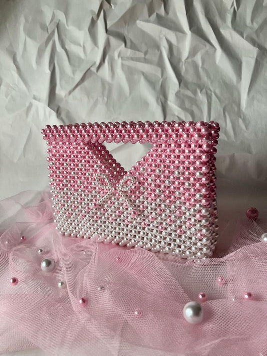 The Rosé Ombre Pearl Bow Clutch